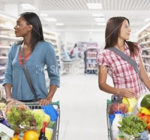 Two women in a grocery aisle